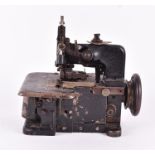 A 19th century metal glove-making machine 24 cm long, approximately 25 cm high. CONDITION REPORT