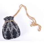 A Judith Leiber jewelled clutch Italian, the enamel clutch in the shape of a drawstring bag,