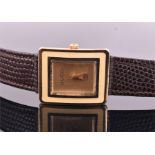 A Gucci silver gilt wristwatch the rectangular plain signed dial with arrow shaped hands, surrounded