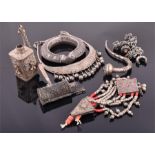 A small quantity of white metal items to include two perfume bottles, a bib necklace with bell