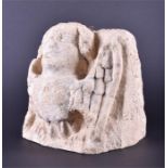 A fragment of weathered ecclesiastical facade limestone carving (possibly Medieval) in the form of a