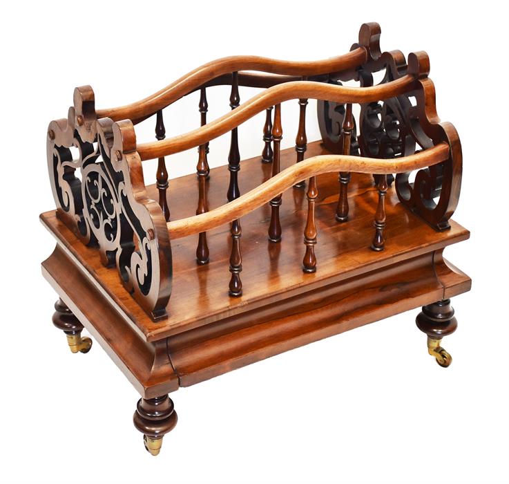 A Regency rosewood three-division Canterbury with scroll and pierced supports, and turned