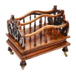 A Regency rosewood three-division Canterbury with scroll and pierced supports, and turned