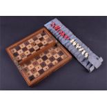 A Victorian/Edwardian travelling chess set  in stained bone, board comprised of mahogany,