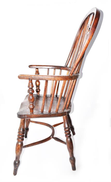 A 19th century elm seated Windsor chair with pierced vase and stick back, and supported on turned - Image 2 of 2