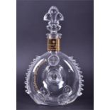 An empty Baccarat Louis XIII Remy Martin cognac decanter with plumed glass stopper, marked to