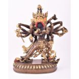 A heavy cast bronze of a four Eastern deity, possibly a Tibetan Brahma figure supported on a