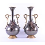A pair of large Continental bronze and metalwork twin-handled vases of baluster form with tapered