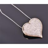 A yellow metal and diamond heart-shaped pendant pavé set with round brilliant-cut diamonds, 3.2 cm