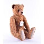 A Charnwood brown teddy bear with long arms, and original tag.