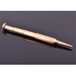A 9ct gold Cartier pencil, stamped "Cartier London", with telescopic action, 9.5 cm maximum