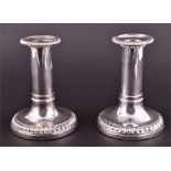 A pair of George III silver candlesticks Sheffield 1817, possibly John & Thomas Settle, each with