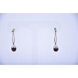 A pair of Edwardian 9ct yellow gold, diamond, and garnet drop earrings set with demi-lune cut