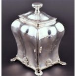A George II silver tea caddy London 1759, by Emick Romer, of rectangular baluster form, on four