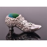 A novelty silver pin cushion in the form of a shoe, stamped 925, 5 cm long.