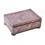 A Victorian work or sewing box the exterior heavily decorated with applied neatly arranged pressed