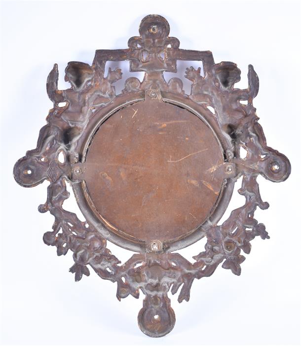 A cast metal framed mirror the open-work bronze-painted frame decorated with two cherubs and the - Image 2 of 2
