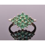 A 9ct yellow gold and emerald cluster ring set with sixteen round cut emeralds, size M, 1.7 grams.