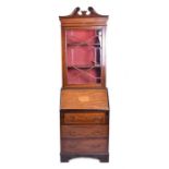 A small inlaid Edwardian bureau bookcase the base accommodating three drawers below a cross-banded