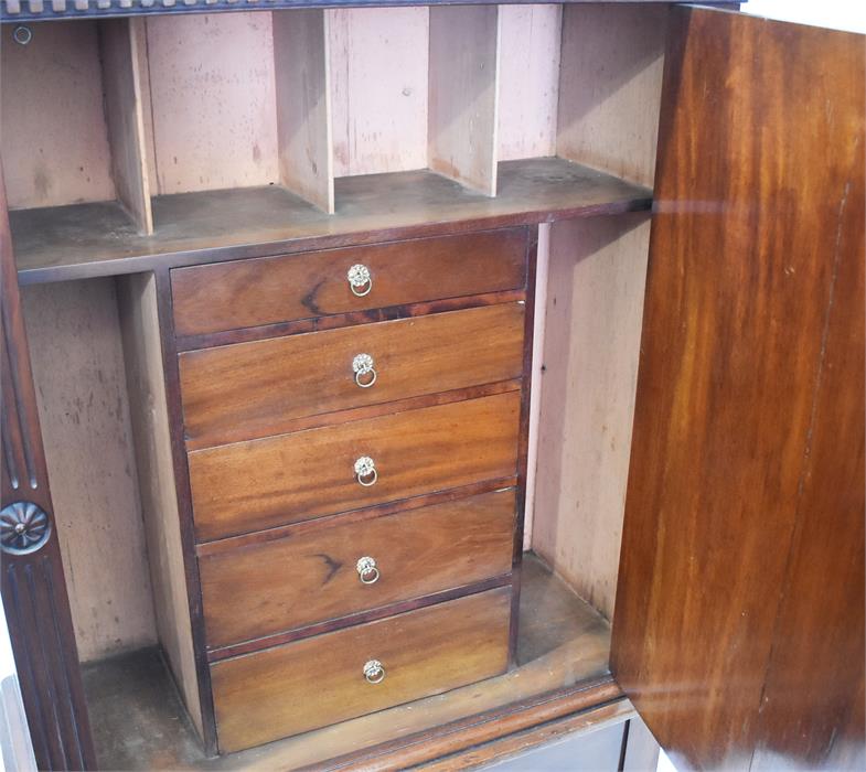 A 19th century walnut cabinet on stand the panelled door inlaid with flowers, opening to reveal a - Image 2 of 2