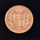 A Victorian full sovereign 1872, with shield back, 8 grams.