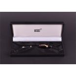 A Mont Blanc Boheme ballpoint pen the clip set with a red gem stone, in original box. CONDITION