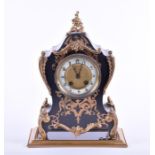 A Victorian ebonised mantel clock with gilt metal mounts, the with white enamel chapter ring, with