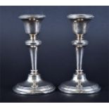 A pair of George V silver candlesticks Chester 1920, by Clark & Sewell, each tapered stem and