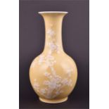 A late 19th / early 20th century Chinese porcelain vase the pear-shaped body with elongated neck,