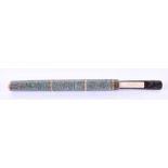 A late 19th century Chinese shagreen cased chopstick and knife set brass banded and ivory capped,