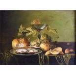 An 18th century Dutch School still life fruit with oysters, nuts, bread and wine, set on a table