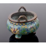 A Chinese cloisonné decorated bronze incense burner of circular form, polychrome decorated with