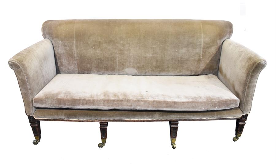 A large Georgian mahogany sofa of stately home proportions upholstered in grey velvet, with deep