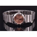 An Omega Constellation stainless steel wristwatch with coppered dial and square hour markers, the