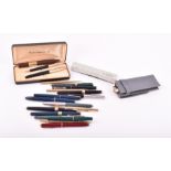 A miscellaneous collection of fountain and ballpoint pens various brands and designs including