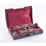 A clarinet by Buffet Crampton & Co of Paris each piece with makers mark, in original red lined