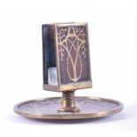 An Art Nouveau match box holder wooden with inlaid brass decoration, heart and vine patterning, base