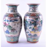 A pair of large late 19th/early 20th century baluster vases heavily decorated with hand painted