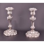 A pair of George IV silver candlesticks Sheffield 1821, by SC Younge & Co., each chased and embossed