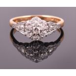 An 18ct yellow gold and diamond floral cluster ring set with seven round brilliant cut diamonds of