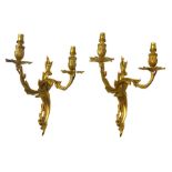 A pair of wall brass Louis XVI style wall sconces decorated with flowers and leaves, converted to