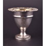 A silver Paul Storr egg cup London 1829, the ovoid body on a spreading pedestal foot, with scroll