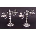 A pair of silver candelabra London 1964, by Roberts & Dore Ltd, each central knopped column on a
