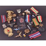 A collection of military cap badges together with a WWII Italy star, A Monte Cassino 1944 cross,