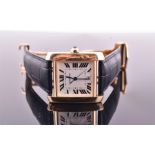 A Cartier Tank Francaise 18ct gold automatic wristwatch the engine turned silvered dial with black