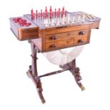 A Regency rosewood games / work table the sliding reversible top with inlaid satinwood chessboard to