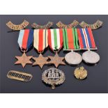 A WWII medal group comprising The Defence Medal, The War Medal, The Italy Star, The Africa Star, and