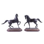 A large pair of late 19th century Continental bronze studies of stallions  in the manner of Pierre
