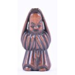 An antique Chinese carved treen figure possibly 18th century, carved in the round in the form of a