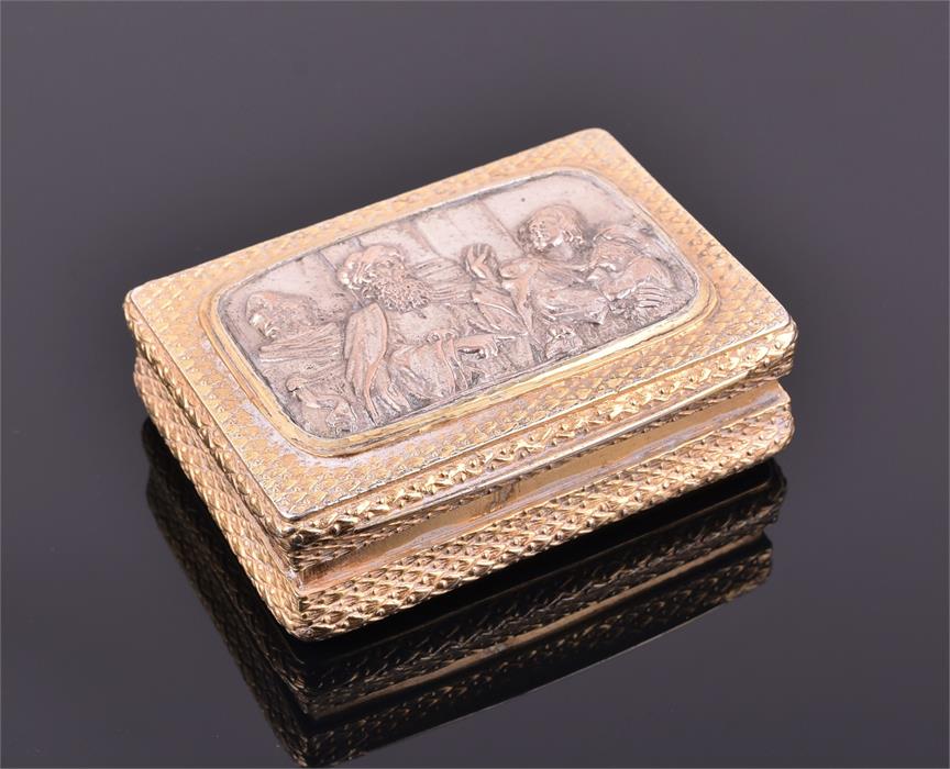 A Continental silver gilt snuff box indecipherable marks, the shaped rectangular gilt body with